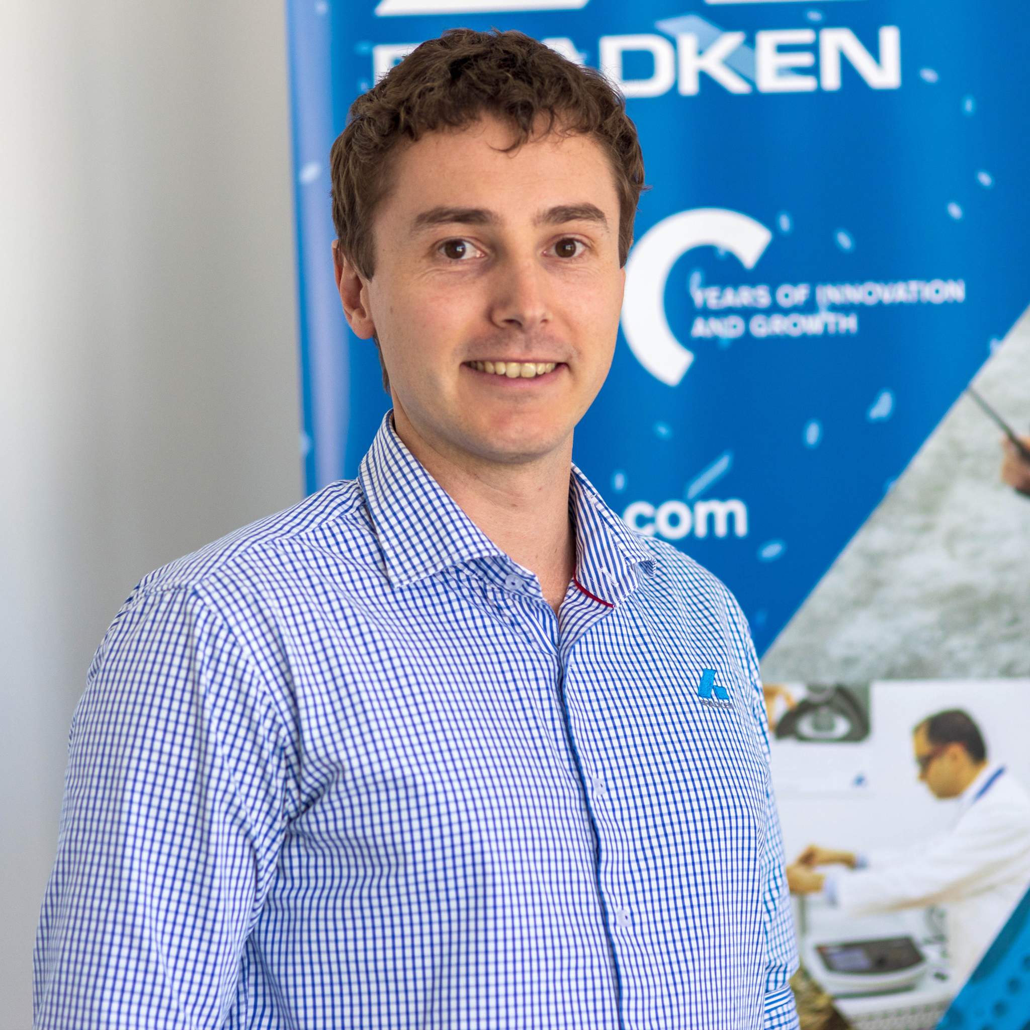 Chris Malone from Bassendean (taken 2023) 100 Year pull-up banner in background